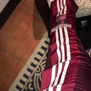Maroon button up adidas pants